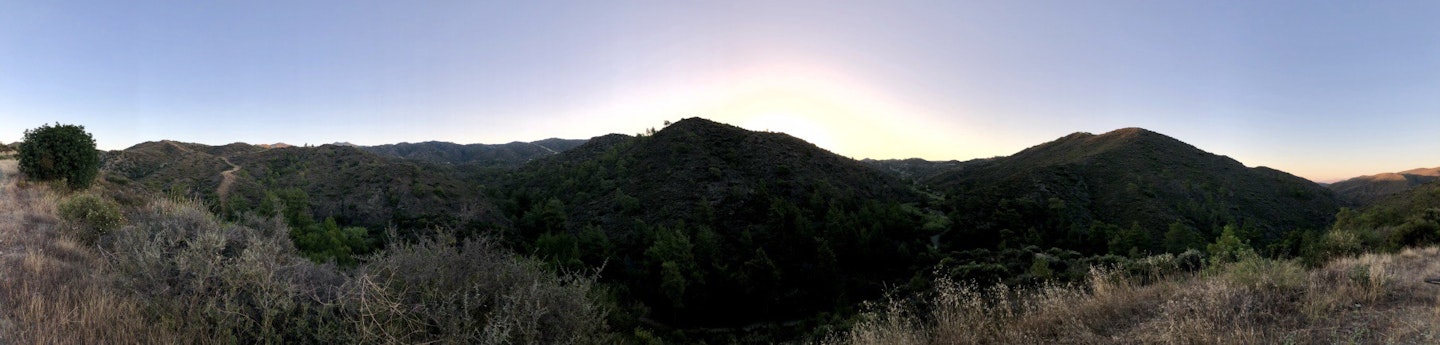 panorama mountains in cyprus with the sun rising in the back