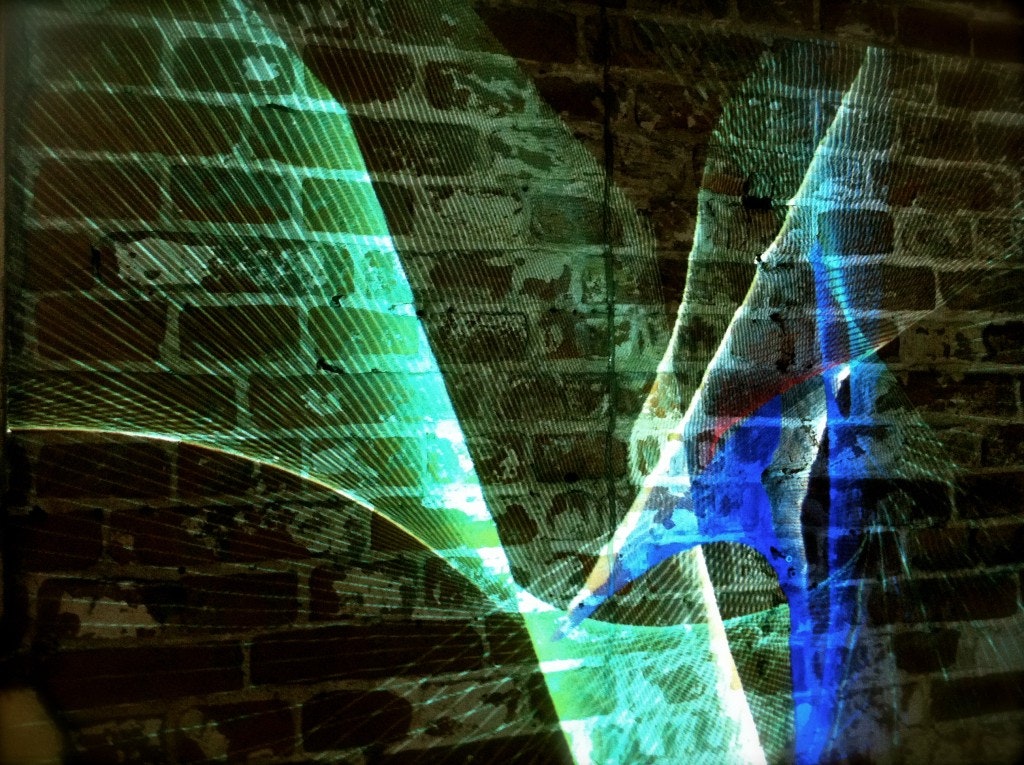 artistic projection on a brick wall